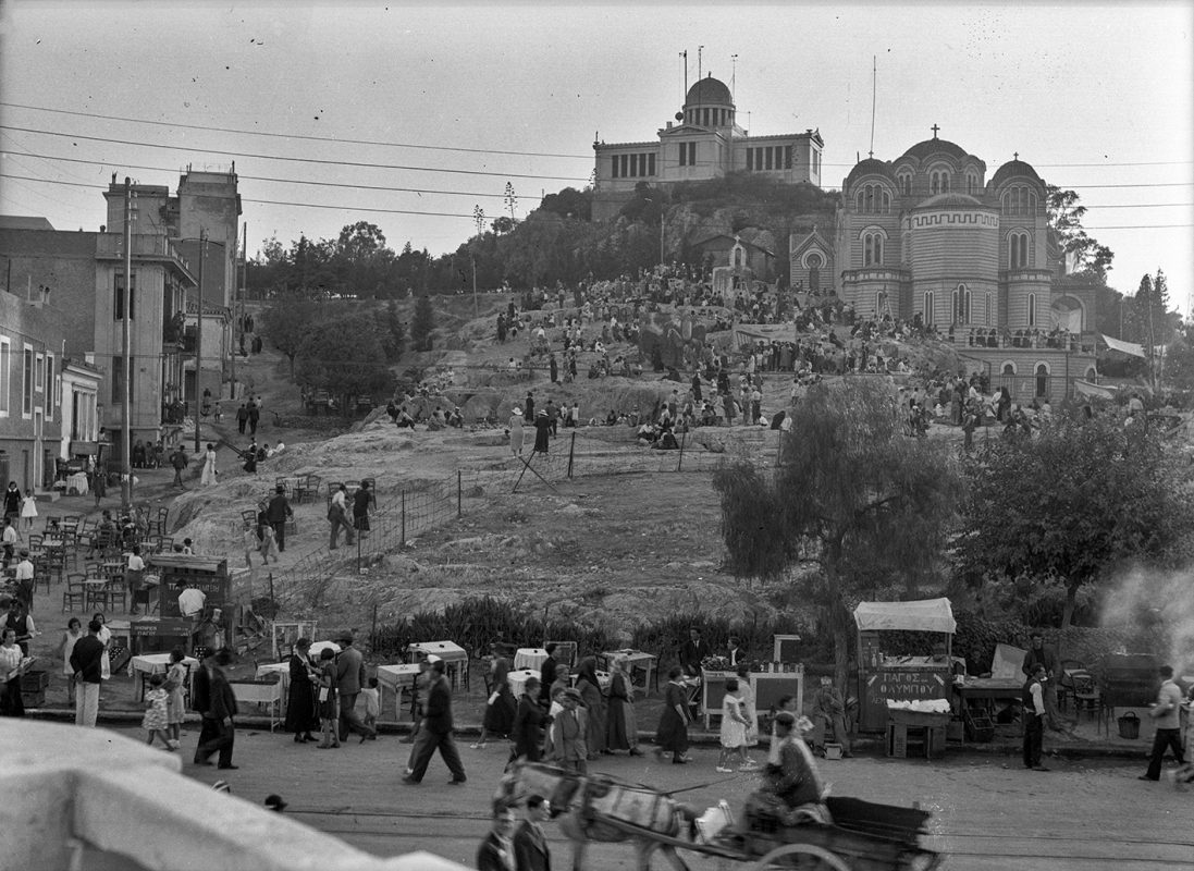 The Athenians, wearing their best of clothes, are scattered around the rocky slope of Agia Marina, possibly in anticipation of the commencement of the Saint's ceremonial celebration day, July 17th (American School of Classical Studies at Athens, Homer A. Thompson Photographic Collection [1271]).